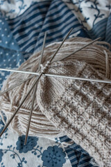 knitting needles and Skeins of wool yarn