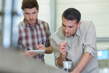 portrait of focused young man working in carpenting studio