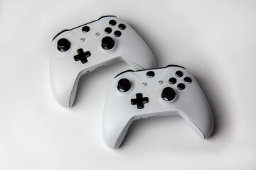 Two Game Controllers on white background isolated 