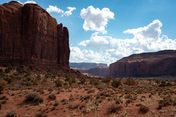 Nice desert landscape with rocky Monument Valley. It's a sunny summer day with blue sky