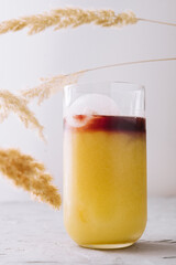 Glass of tasty coffee with orange juice