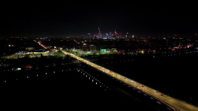 Drone view of the Metropolis Building at night and a street with heavy traffic. Crossroad Night capital of Warsaw Europe Poland
