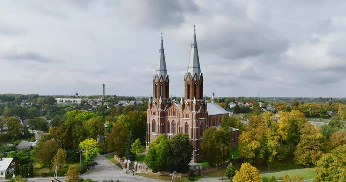 Drone view of Church in Anyksciai, Lithuania, eastern Europe. City Church are visible in the frame. High quality aerial footage.