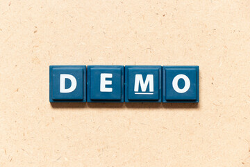 Tile letter in english word demo on wood background