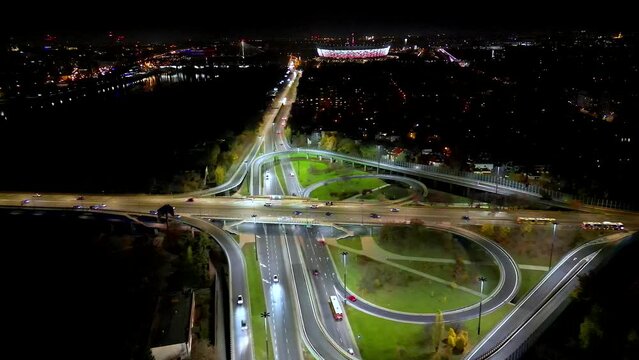 Drone view of the Metropolis Building at night and a street with heavy traffic. Crossroad Night capital of Warsaw Europe Poland