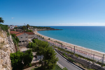 Tarragona Spain beach coast and railway Costa Daurada Catalonia with blue Mediterranean sea
