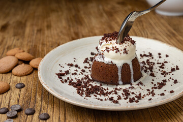 Tasting of chocolate fondant in restaurant.
