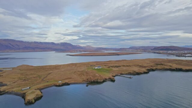 Lonely House On Secluded Island In Arctic Circle Icelandic Bay. Aerial Drone Footage.