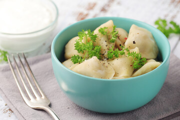 Russian national dish pelmeni served in a plate