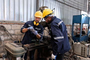 In robotic repair shop engineer use drilling machine fabricate part and vernier caliper measuring
