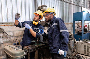 In robotic repair shop engineer use drilling machine fabricate part and vernier caliper measuring
