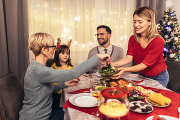 Happy multi-generation family enjoying in a lunch together at home. Family on Christmas dinner at home