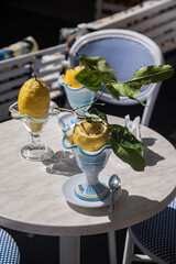 Traditional Amalfi dessert - lemon sorbet in lemon. Citrus delight, unusual street food.