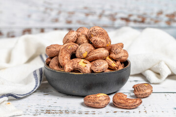 Cashew nuts on wood background. Raw cashews. Healthy food. close up