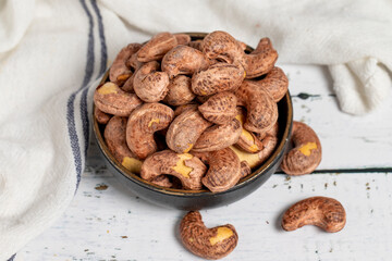 Cashew nuts on wood background. Raw cashews. Healthy food. close up