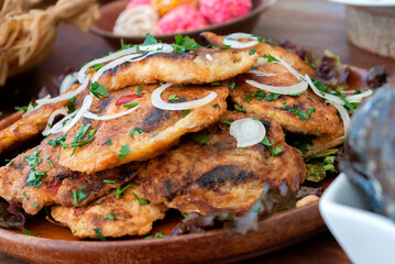 Dish served with stuffed chiles wrapped in egg, typical food from Guatemala, Central America.