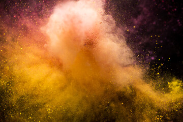 Colored powder explosion isolated on black background
