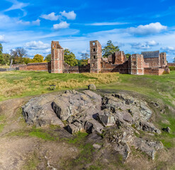 An aerial view of charnian rock outcrops in front of the ruins of Bradgate house in Bradgate Park,...