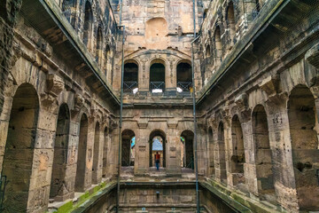 Naklejka premium Picturesque view of the inner court with the middle stories inside the famous Porta Nigra, a large Roman city gate in Trier, Germany. The Porta Nigra was built in grey sandstone after 170 AD.