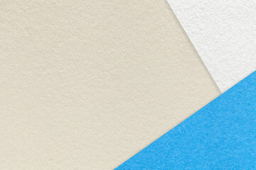Texture of craft light beige color paper background with blue and white border. Vintage abstract sand cardboard.