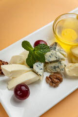 delicious snacks in the restaurant. on an orange background

