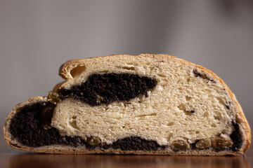 close-up of poppy and raisin pie roll cut - with blurred background