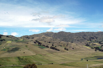 Obraz premium Patchwork of farm fields on the slope of a mountain near Latacunga, Ecuador