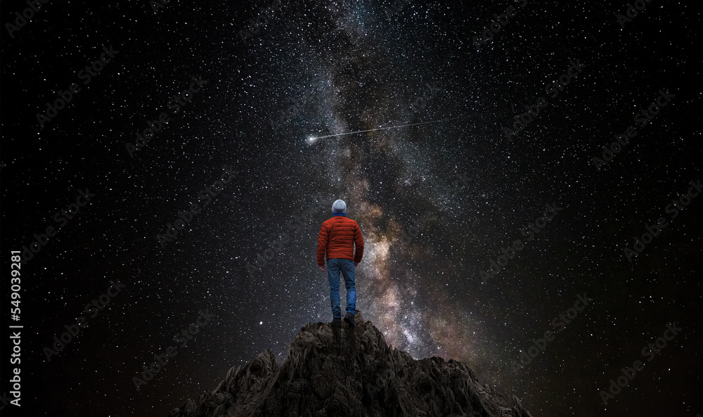 Canvas Prints man observes the universe from the top of a mountain