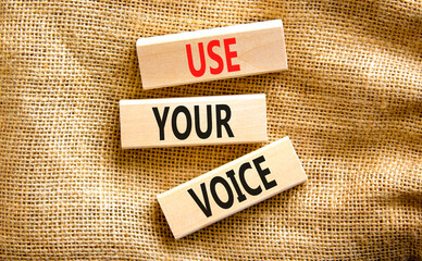 Use your voice symbol. Concept words Use your voice on wooden blocks on a beautiful canvas table canvas background. Business and use your voice concept. Copy space.