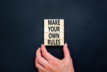 Make your own rules symbol. Concept words Make your own rules on wooden cubes. Beautiful black...