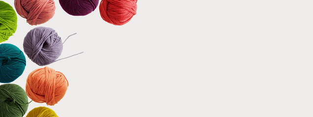 Balls of soft wool colored yarn for hand knitting and crochet on white background. Winter hobby concept. Mock up, flat lay, copy space, banner