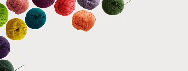 Balls of wool colorful yarn for hand knitting and crochet on white background. Winter recomforting hobby concept. Mock up, flat lay, copy space, banner