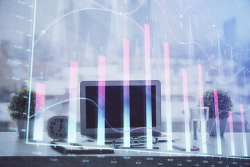 Forex graph hologram on table with computer background. Multi exposure. Concept of financial markets.