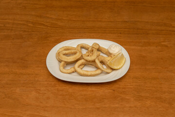 Calamari like this may need to go on a platter with a lemon wedge, or is sometimes served as a snack