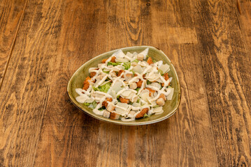 Caesar salad is a salad of romaine lettuce and croutons with lemon juice, olive oil, egg, Worcestershire sauce, anchovies, garlic, Dijon mustard, Parmesan cheese, and black pepper