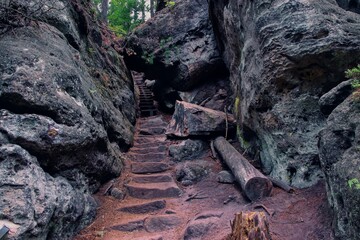 The valley with rock trail in deep forest near Kyjov, Bohemian Switzerland, Czech republic