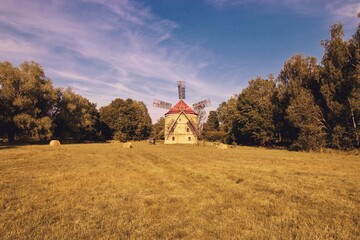The windmill Svetlik at the meadow near Krasna Lipa, Czech republic