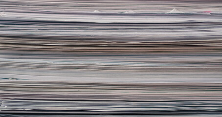 Stack of blank papers with binder clips on wooden table indoors. Workplace. Many documents, contracts, legal agreements, papers on work table. Concept of business, working, job