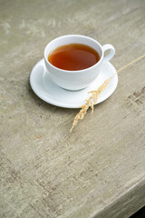 Minimalist tea is served on the concrete table.