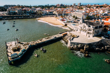 Fototapeta na wymiar Aerial view of Cascais bay, Portugal with giant ferris wheel visible which was set up for the Christmas season
