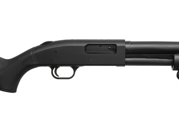 Pump-action 12 gauge shotgun isolated on a white back. A smooth-bore weapon with a plastic stock.