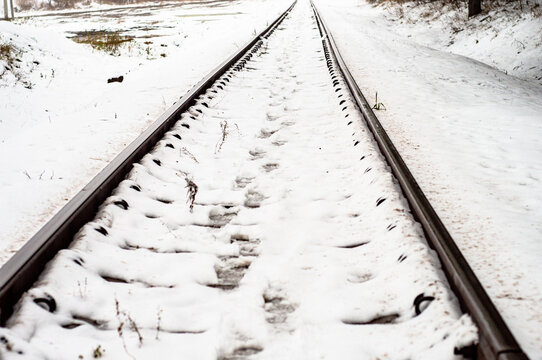 railroad tracks in the snow