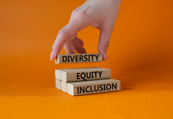 Diversity Equity Inclusion symbol. Concept words Diversity Equity Inclusion on wooden blocks....