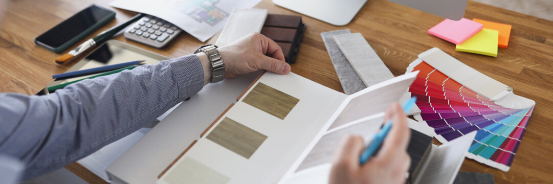 Interior designer create color mix for new house project, palette on workplace in agency