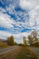 Fototapeta na wymiar Amazing autumnal scene with trees and cloudy sky, Armenia