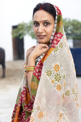 Portrait indian woman in sari at village.