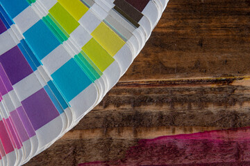 Color swatches used in graphic arts, on wooden table