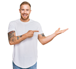 Young irish man wearing casual clothes amazed and smiling to the camera while presenting with hand and pointing with finger.