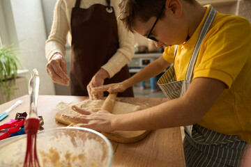 Close up photo of boy cooking at home