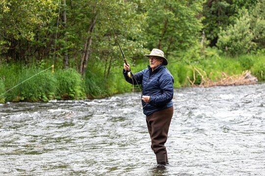 Rear closeup of a man enjoying fishing on Monnow Valley Fishery